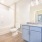 Grey Cabinetry + Curved Shower Rods in Bathrooms